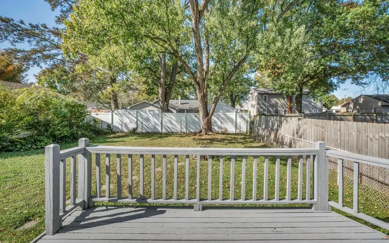 Deck repair in Chattanooga, TN: backyard deck with white railing