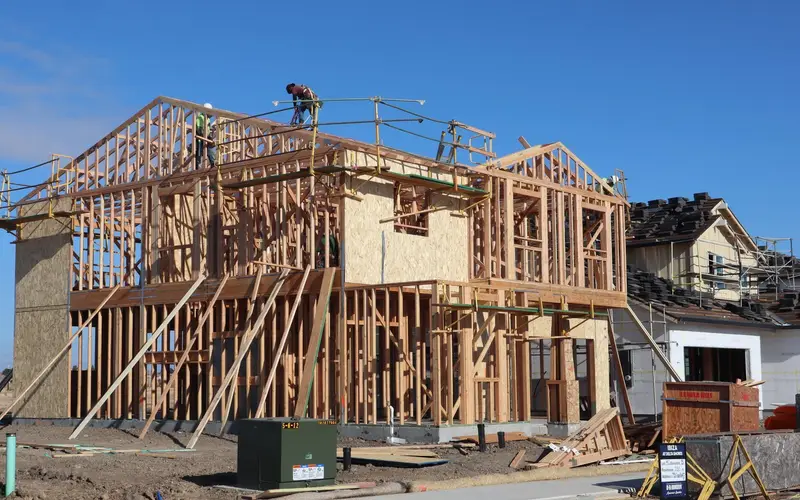Construction contractors framing a house in Chattanooga, TN
