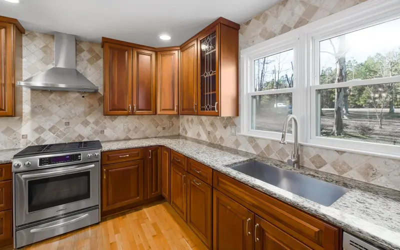 Kitchen remodeling in Chattanooga, TN: wood cabinets and granite counters
