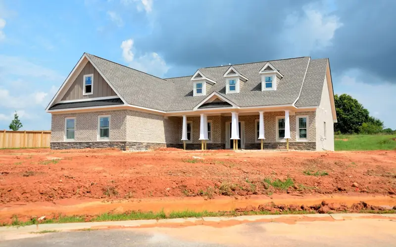 Home builder in Chattanooga, TN: new house under construction on a red-clay lot